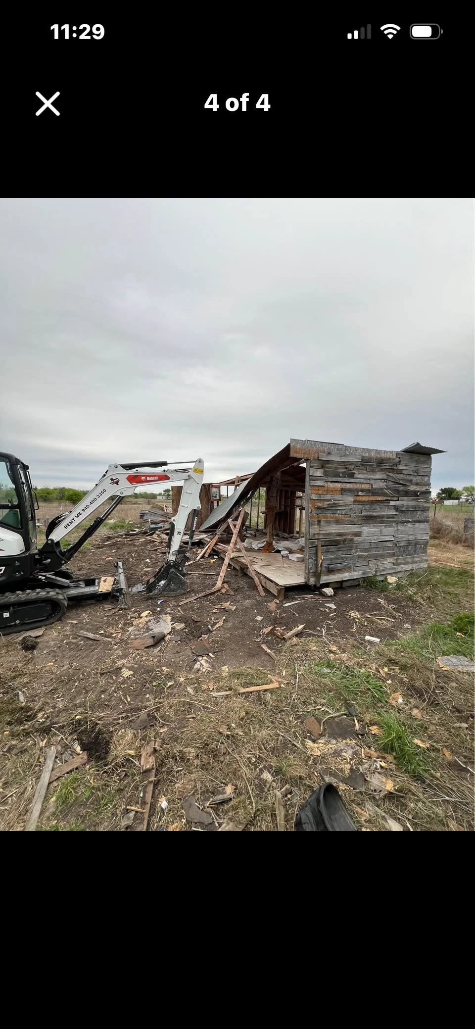 JK Hauling crew performing shed demolition and debris removal at a Colorado home