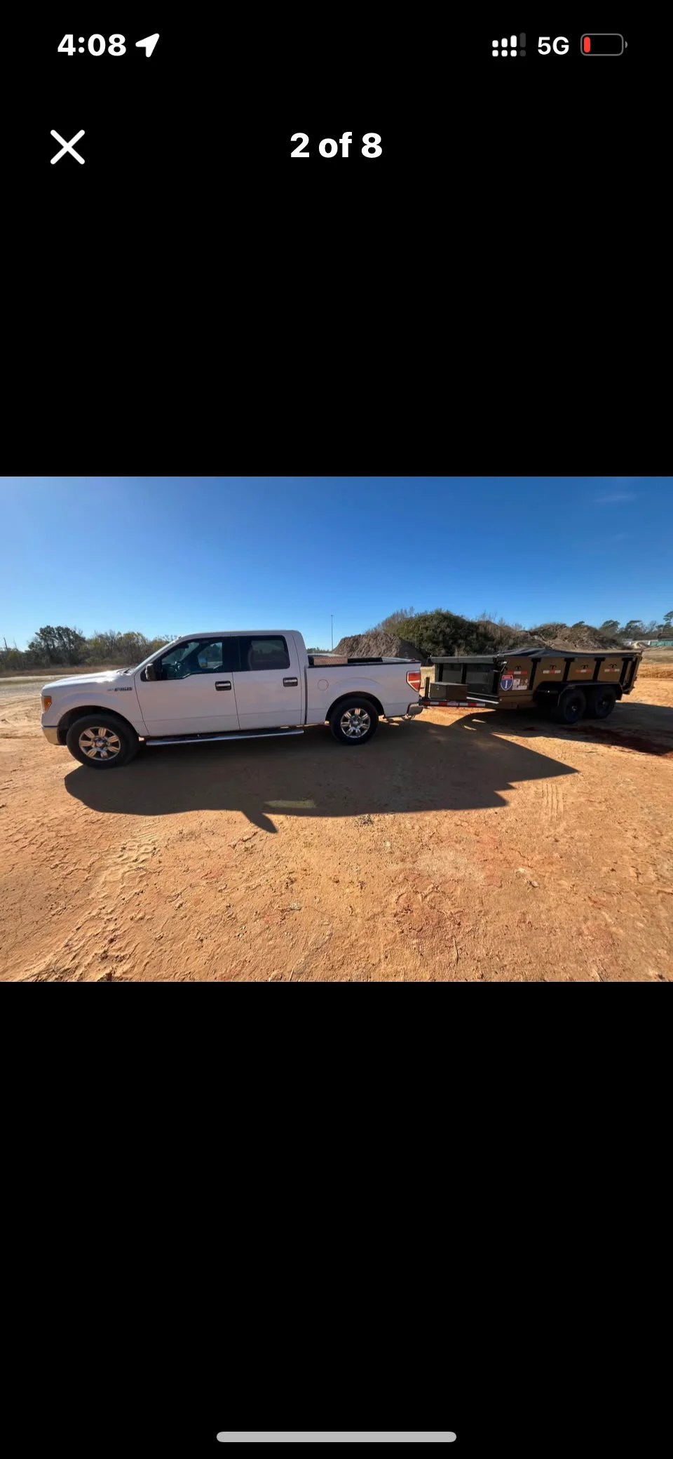 JK Hauling truck loaded with junk and debris ready for disposal in Colorado